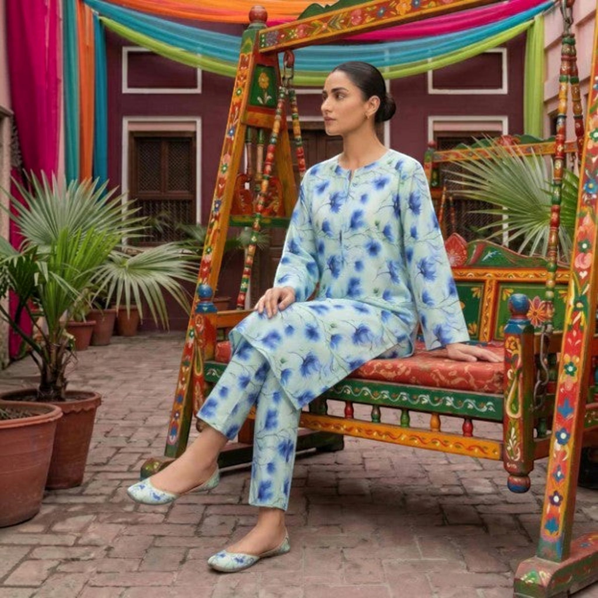 Saha Couture 2-piece stitched lawn suit with blue floral digital print on light green cotton shirt and trousers.